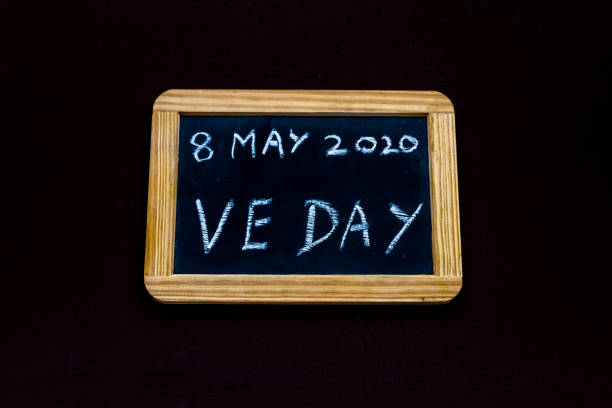 Old fashioned school writing slate with 8 May 2020 VE Day, copyspace - fotografia de stock