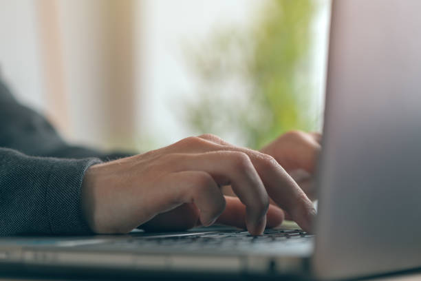 istock Businesswoman typing laptop computer keyboard 1156528747