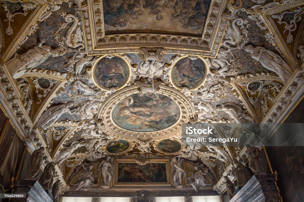 Venice. Doge's Palace, ceiling in the Atrium Italy, Venice. Doge's Palace, ceiling in the Atrium
 (The Square Atrium) is decorated with stucco and frescoes made by Veronese, Tintoretto and Bassano. Doge's Palace - Venice Stock Photo
