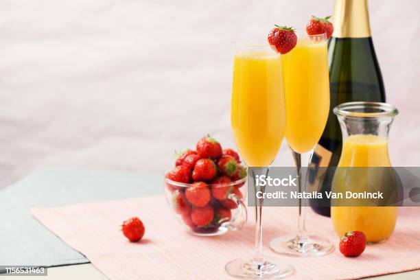 Mimosa Cocktail And Strawberries Stock Photo - Download Image Now - Mimosa, Brunch, Champagne