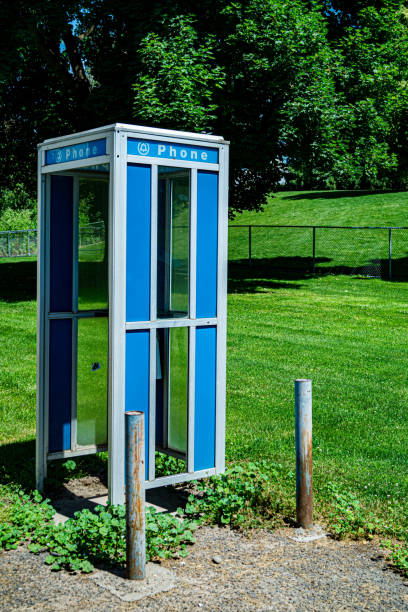 istock Phone booth in front of a freshly cut lawn 1156532742