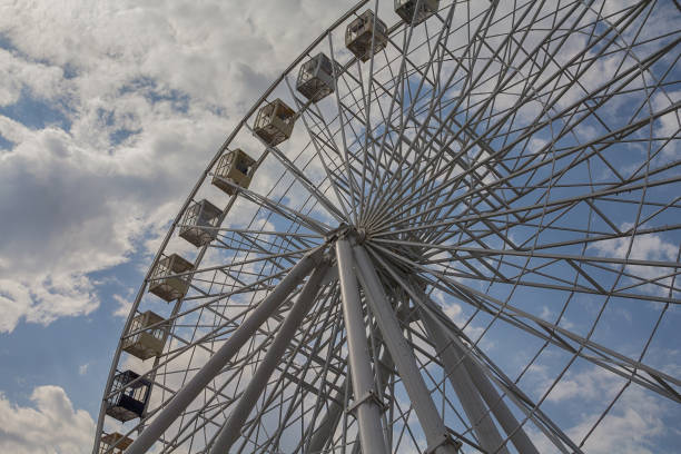 istock Ferris wheel on a background of blue sky and clouds 1156533671
