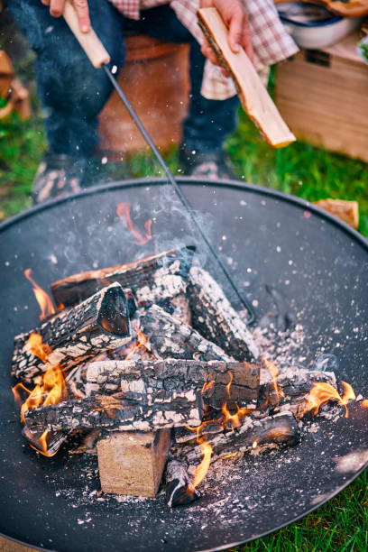 istock Making an Open Campfire for Outdoor Cooking 1156533926