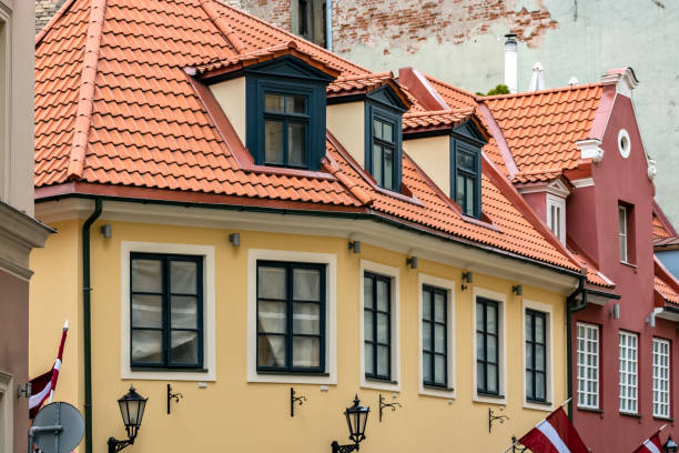 Yellow house with red roof.