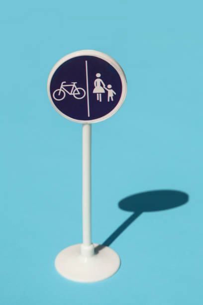 Bicycle and pedestrian lane road sign isolated on blue background