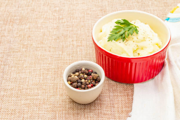 istock Warm mashed potatoes in a ceramic bowl with fresh parsley 1156541659