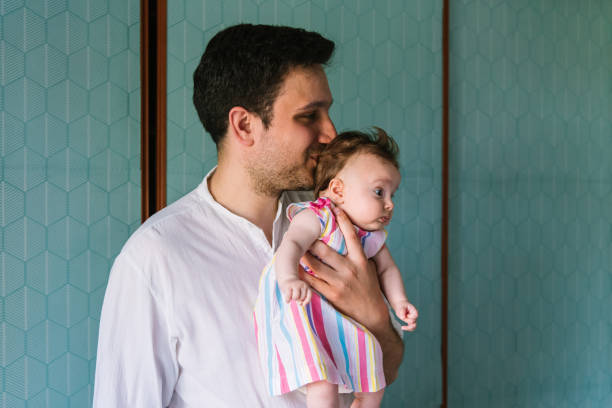 istock Father with his newborn baby 1156543956