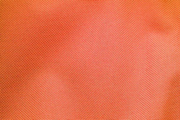 fond de texture de tissu en nylon orange - nylon photos et images de collection