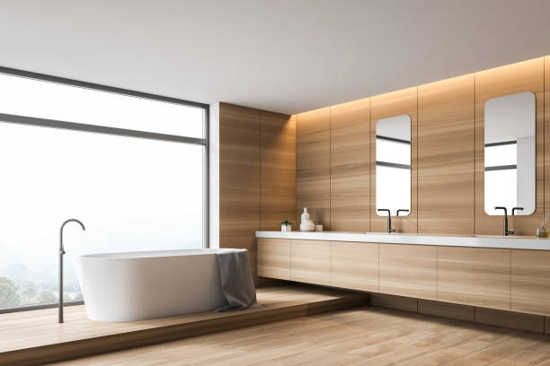 istock Wooden bathroom corner with tub and double sink 1156548563