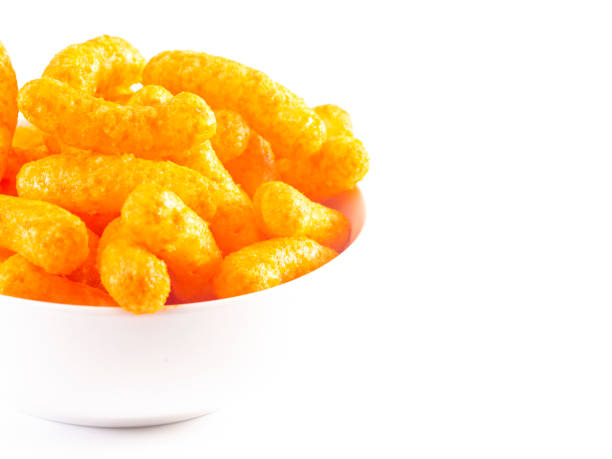 istock Orange Cheddar Cheese Puffs Isolated on a White Background 1156548850