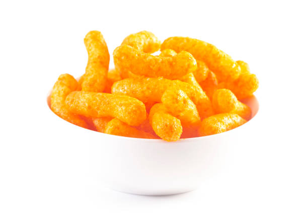 istock Orange Cheddar Cheese Puffs Isolated on a White Background 1156548910