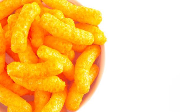 istock Orange Cheddar Cheese Puffs Isolated on a White Background 1156548917