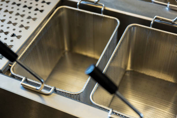 istock New empty modern professional fryer basket in kitchen restaurant 1156552385