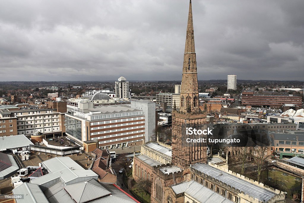 Aerial view of Coventry Cathedral and the city under clouds Coventry in West Midlands, England. Old town aerial view from ruined cathedral tower. Prominent Holy Trinity Church. Coventry Stock Photo