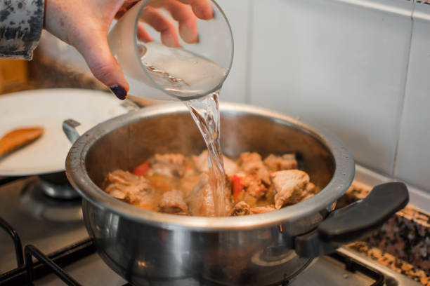 istock Preparing lunch for the family. Cooking in a kitchen. 1156554813