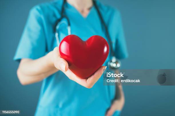 Medicine Doctor Holding Red Heart Shape In Hand Medical Concept Stock Photo - Download Image Now