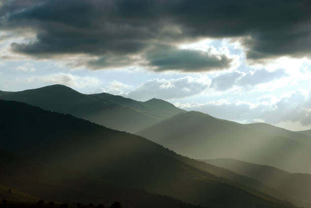 istock Mountain  landscape under evening sky with clouds in sunlight. 1156555249