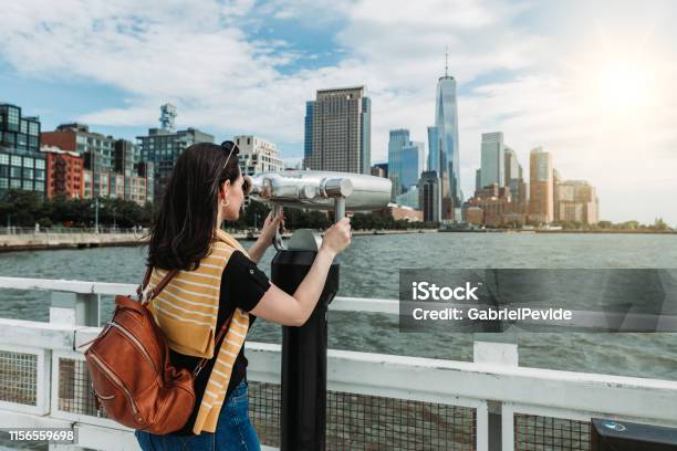 Woman Traveling In New York Using The Tourist Binoculars Stock Photo - Download Image Now