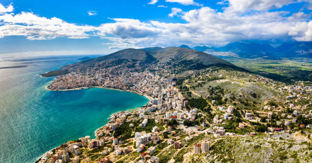 Aerial view of Saranda with Lekuresi Castle in Albania Aerial panorama of Saranda with Lekuresi Castle in South Albania albania photos stock pictures, royalty-free photos & images