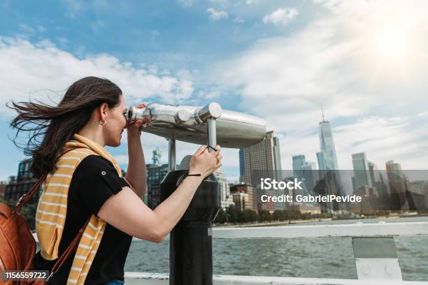 Woman Traveling In New York Using The Tourist Binoculars Stock Photo - Download Image Now