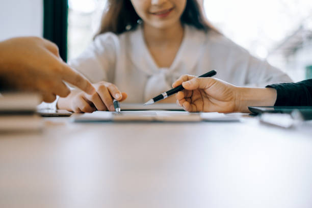 istock Business people analyzing investment graph meeting brainstorming and discussing plan in meeting room, investment concept 1156574370