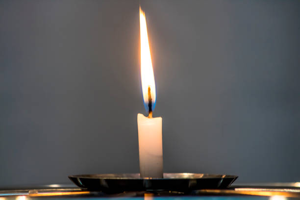 istock flame candle isolated in Brazil 1156583500