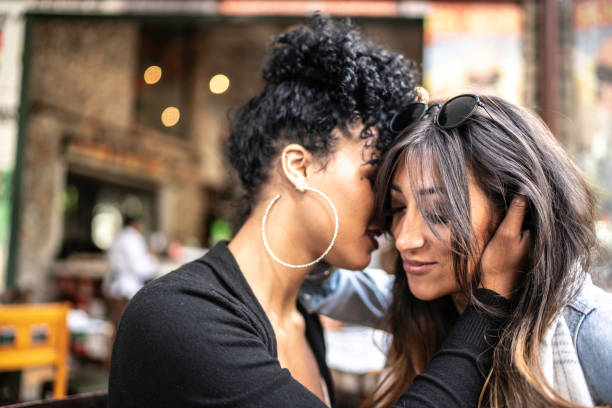 istock Romantic lesbian couple at restaurant 1156583523