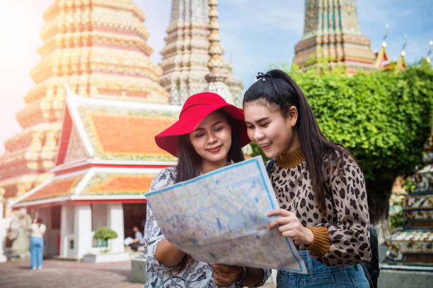 istock Young tourist traveling in Thai temple 1156601498