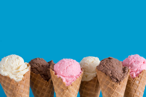 istock Ice Cream Cones on a Colorful Blue Background 1156607241