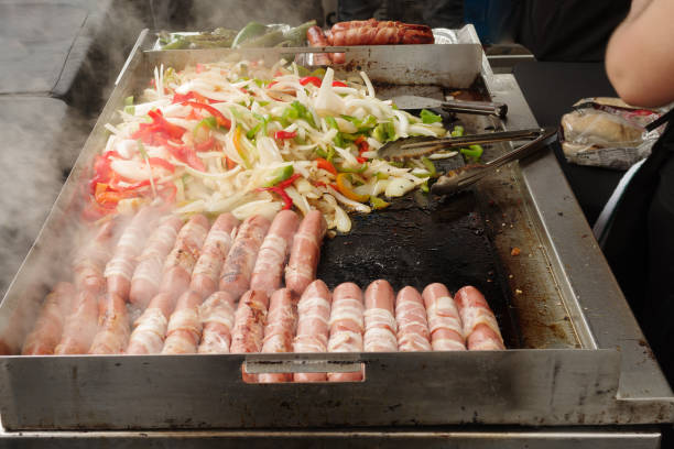 Hot Dogs Onions and Peppers Image showing a hot dog stand during the Pasadena Chalk Festival. hot dog stand stock pictures, royalty-free photos & images