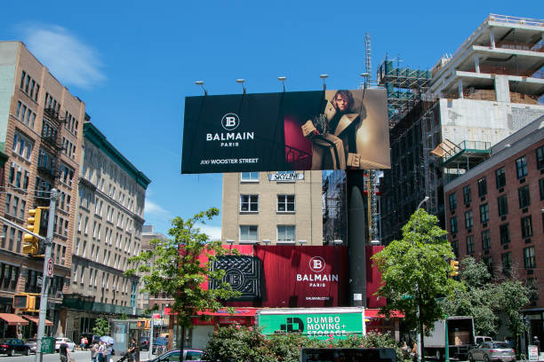 Balmain Paris billboards New York, 6/15/2019: View of a large Balmain store advertisement as seen from Houston Street. soho billboard stock pictures, royalty-free photos & images