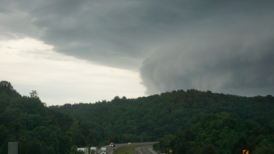 Today traveling on the Kentucky interstate these moody clouds appeared before rain and wind.  Radar showed a storm coming but nothing spoke the reality of the size of this storm like the actual storm clouds did.  It was massive and overwhelming.