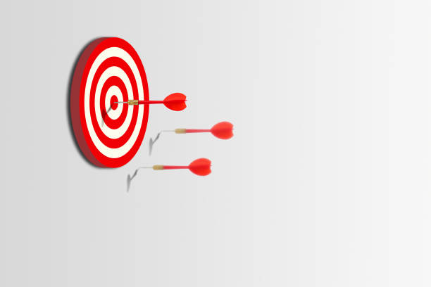 istock Marketing Concept : One of group red darts hit target on dartboard. 1156616273