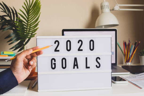 istock 2020 Goals text on light box on desk table in home office 1156616294