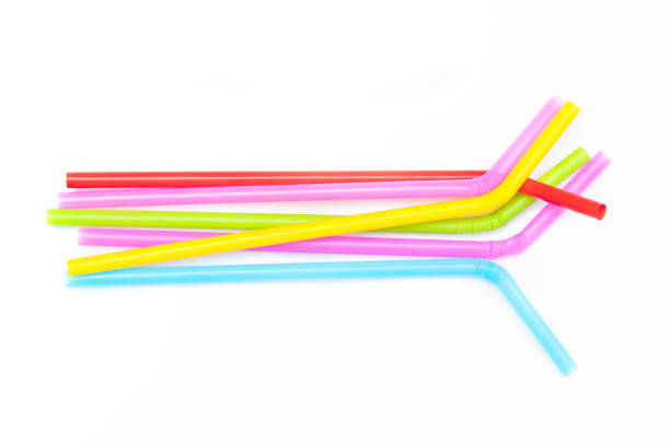 istock Pile of colorful plastic drinking straws isolated on white background. 1156616311