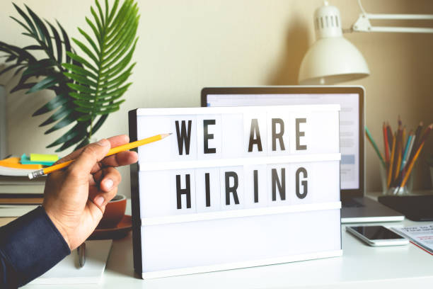 istock We are hiring text on light box on desk office.communication and  announcement concepts 1156616816