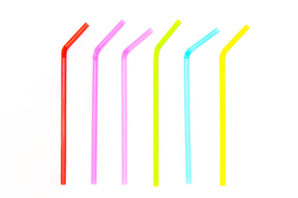 istock Pile of colorful plastic drinking straws isolated on white background. 1156616822
