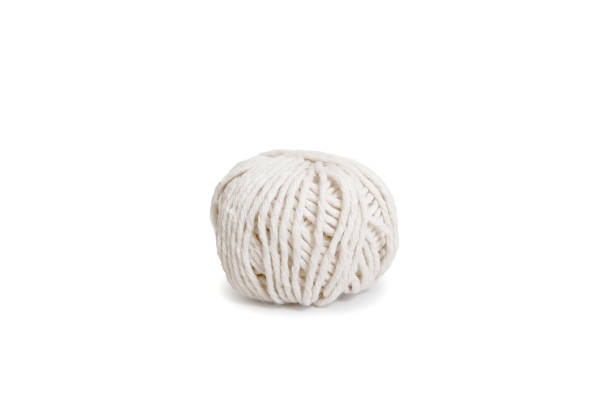 Ball of white yarn. Isolated skein of wool boho logo stock photo