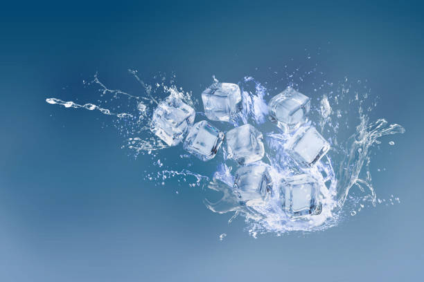 istock Ice cubes isolated over a blue background and copy space 1156627978