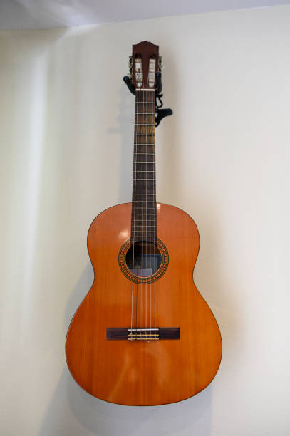 istock Acoustic guitar hanging decorative on wall 1156631485
