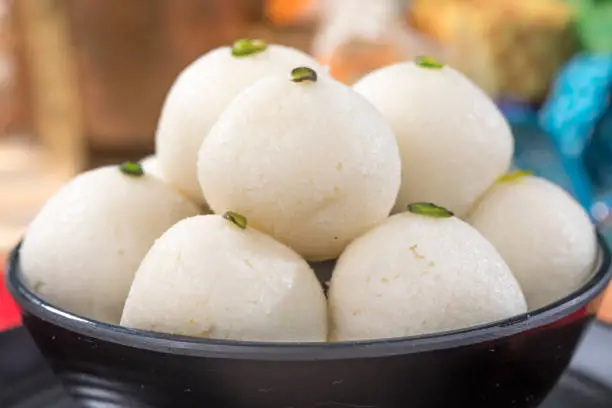Indian Famous sweet food Rasgulla or Rosogulla served in a bowl