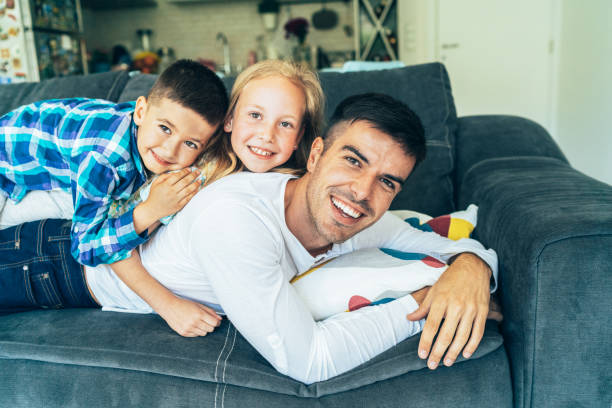 istock Father and children's time 1156631838