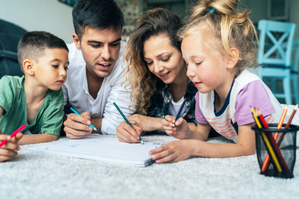 istock Young family drawing 1156631841
