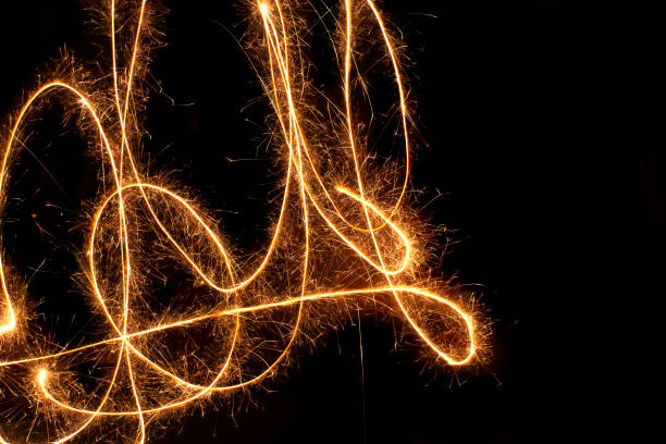 istock Sparkle firework writing sign/symbol on black background 1156633046