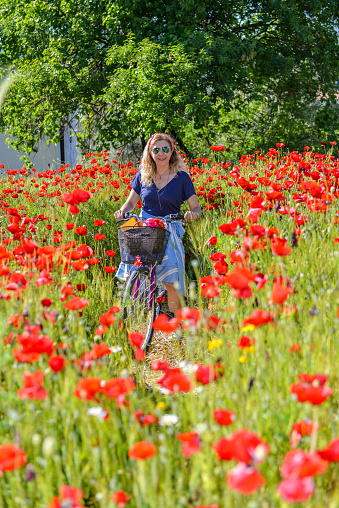 Woman in poppies.