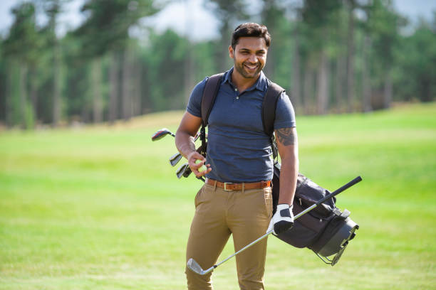 istock Male golfer standing on golf course 1156637275