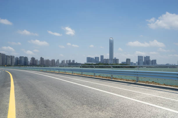 istock empty road with cityscape in modern city 1156640007