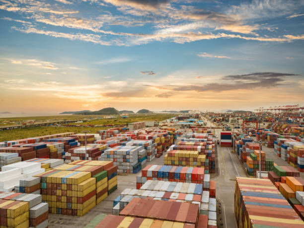 istock Logistics and transportation of Container Cargo ship and Cargo plane with working crane bridge in shipyard 1156640009