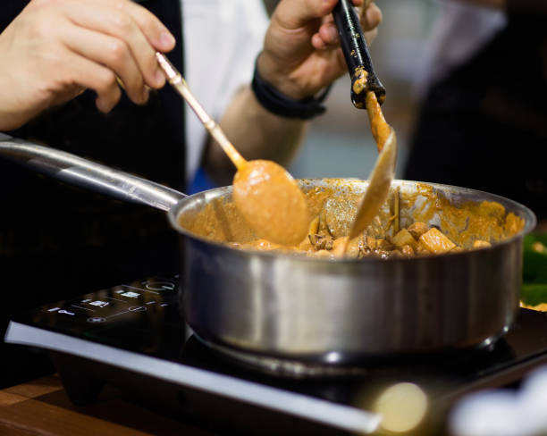 istock Chef preparing food in the kitchen, chef cooking, Chef decorating dish 1156640039