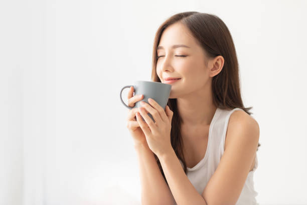 istock Attractive girl is holding a grey mug. 1156640357